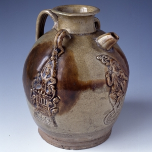 Height: 16.4cm; diameter at mouth: 5.8cm; diameter at the bottom: 9.9cm Unearthed from a well in Hengyang, Hunan Province in 1973. Celadon porcelain ewer with dancing figure design